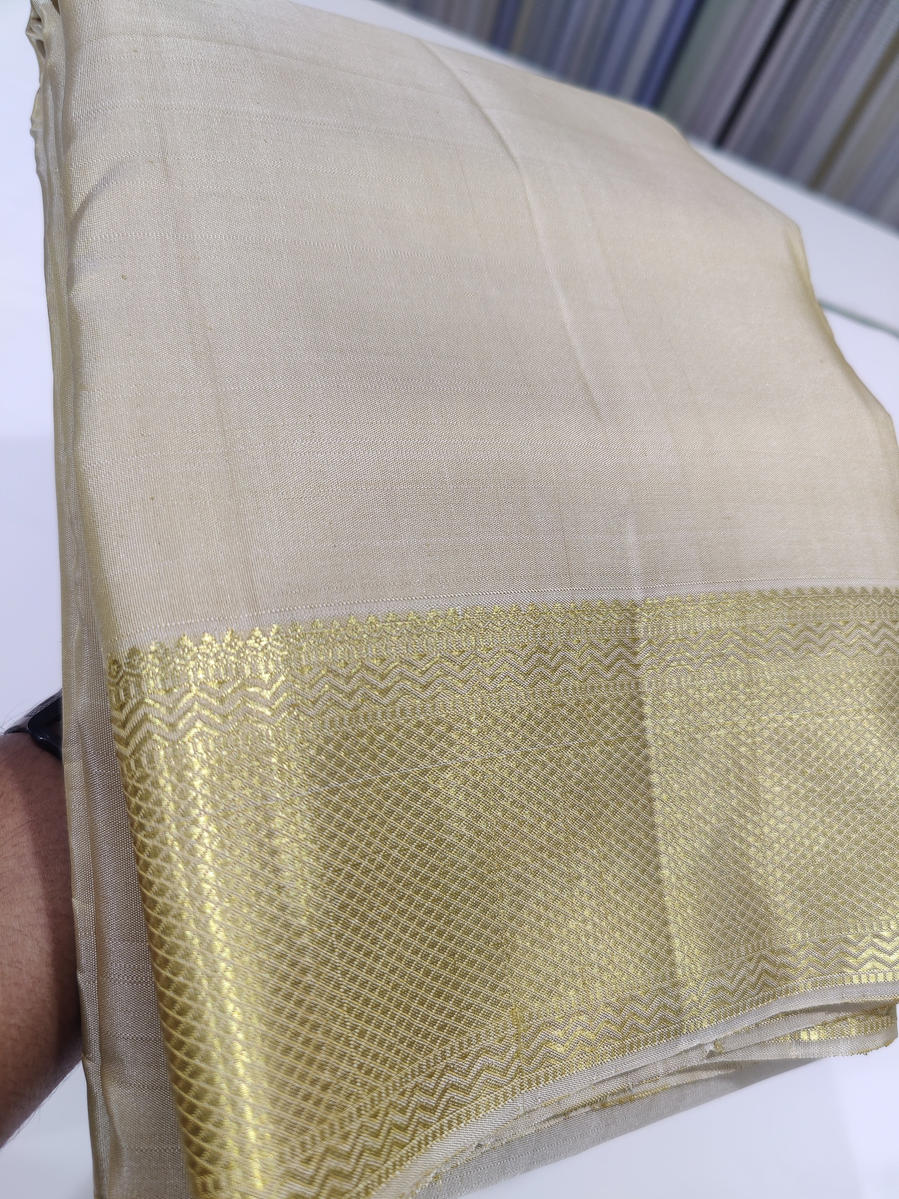 "Cream Kanjivaram Silk Dhoti with Gold Zari Border – Wedding Collection for Men" - New Sudarshan Silks`