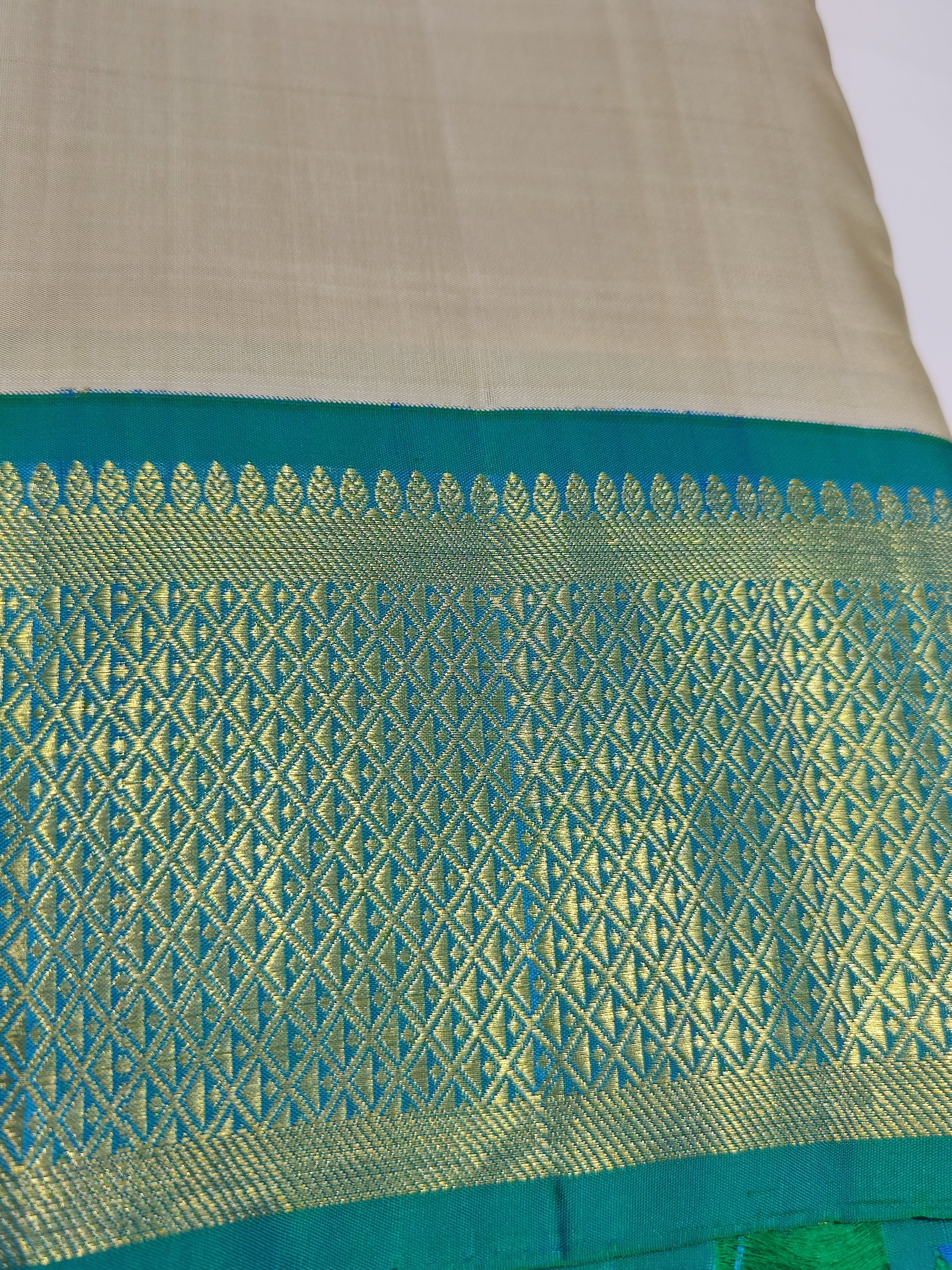"Pure Cream Kanjivaram Silk Dhoti with Rama Green & Gold Zari Border + Shirt Piece – Wedding Collection" - New Sudarshan Silks`