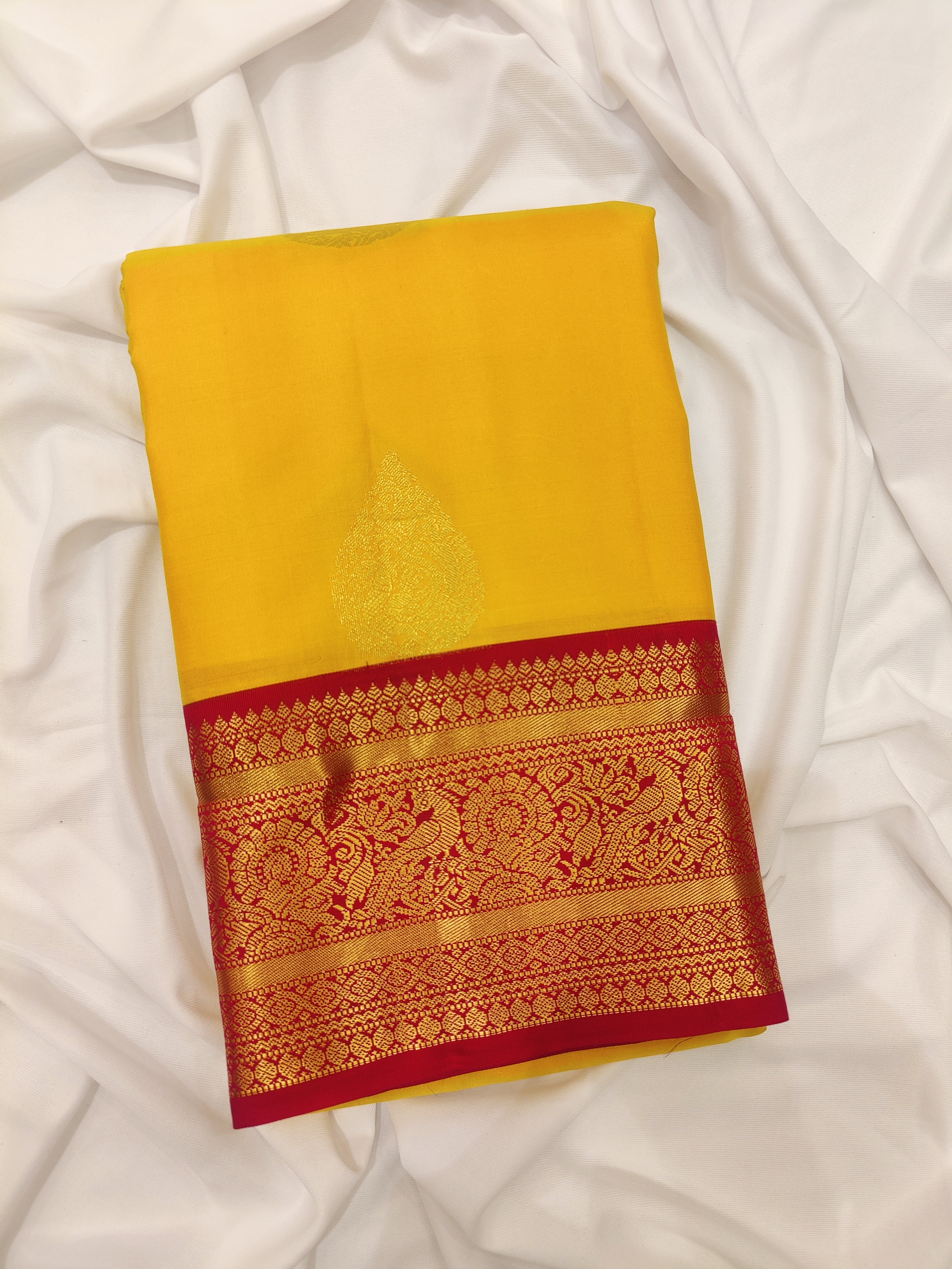 Yellow Kanjivaram Silk Saree with Red Traditional Zari Border – Elegant Handloom Wedding Saree Online - New Sudarshan Silks`