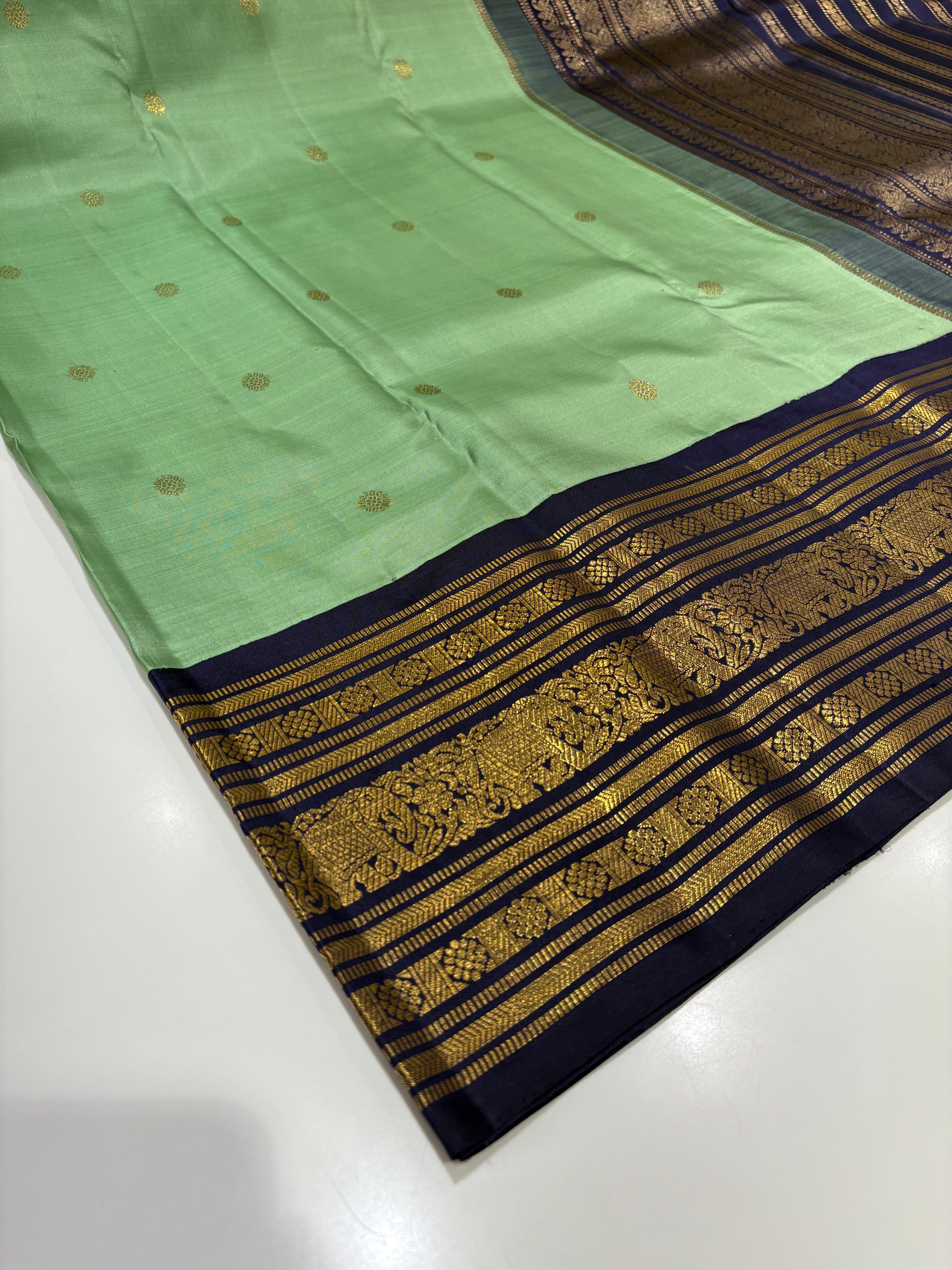 Green Kanjivaram Silk Saree with Contrast Blue Border & Zari Buttas