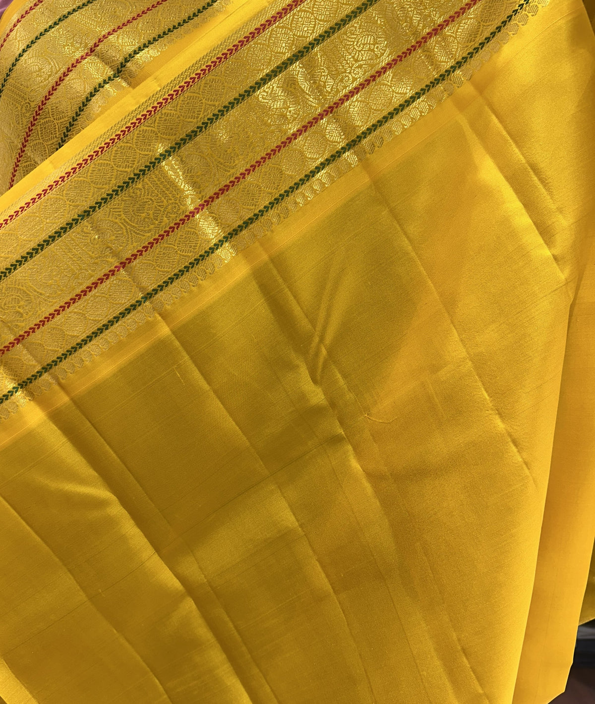 Dark Green colour Pure Kanjivaram Silk Saree with Yellow contrast nss001