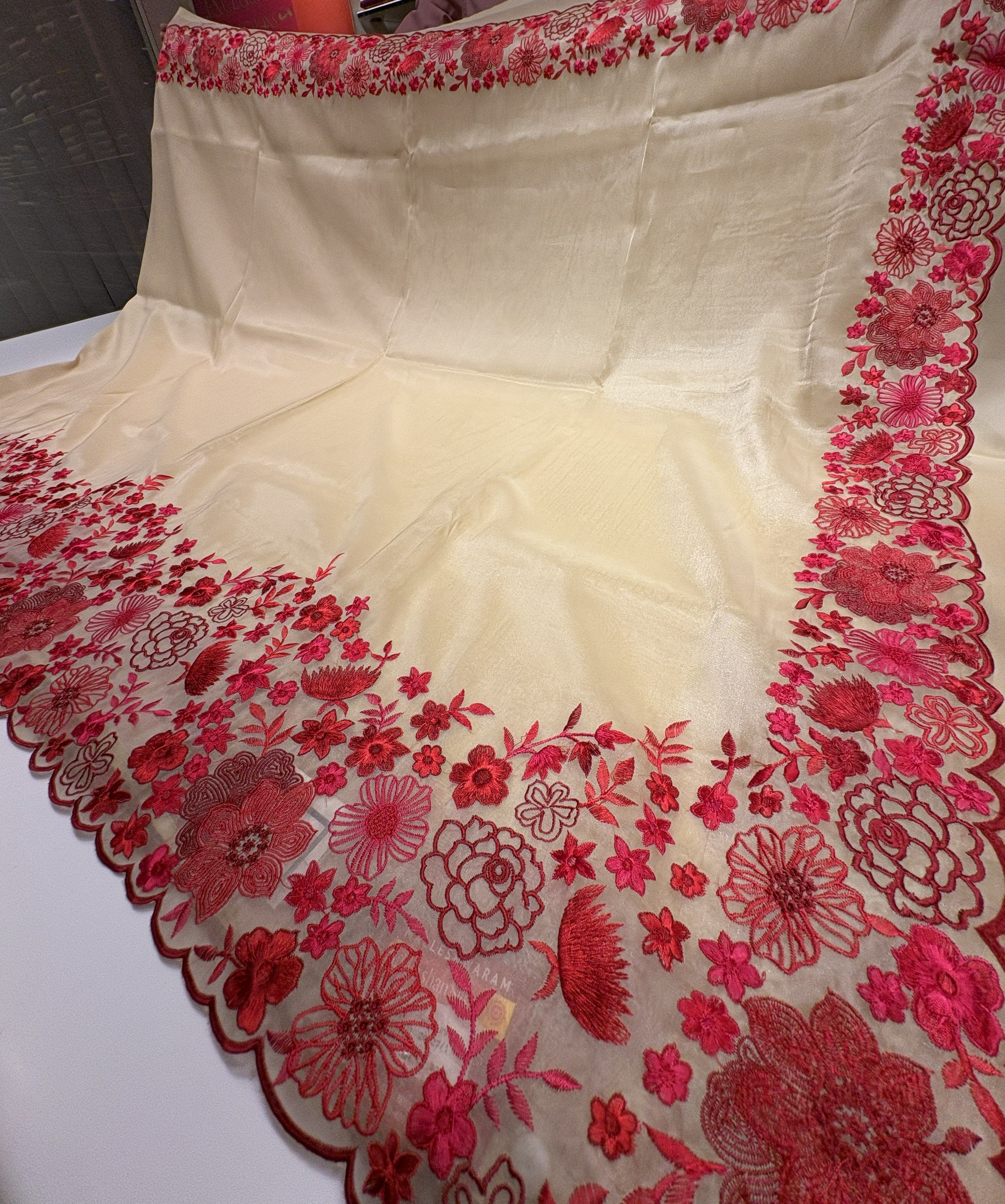 Elegant Cream Tissue Organza Saree With Fancy Red Floral Border