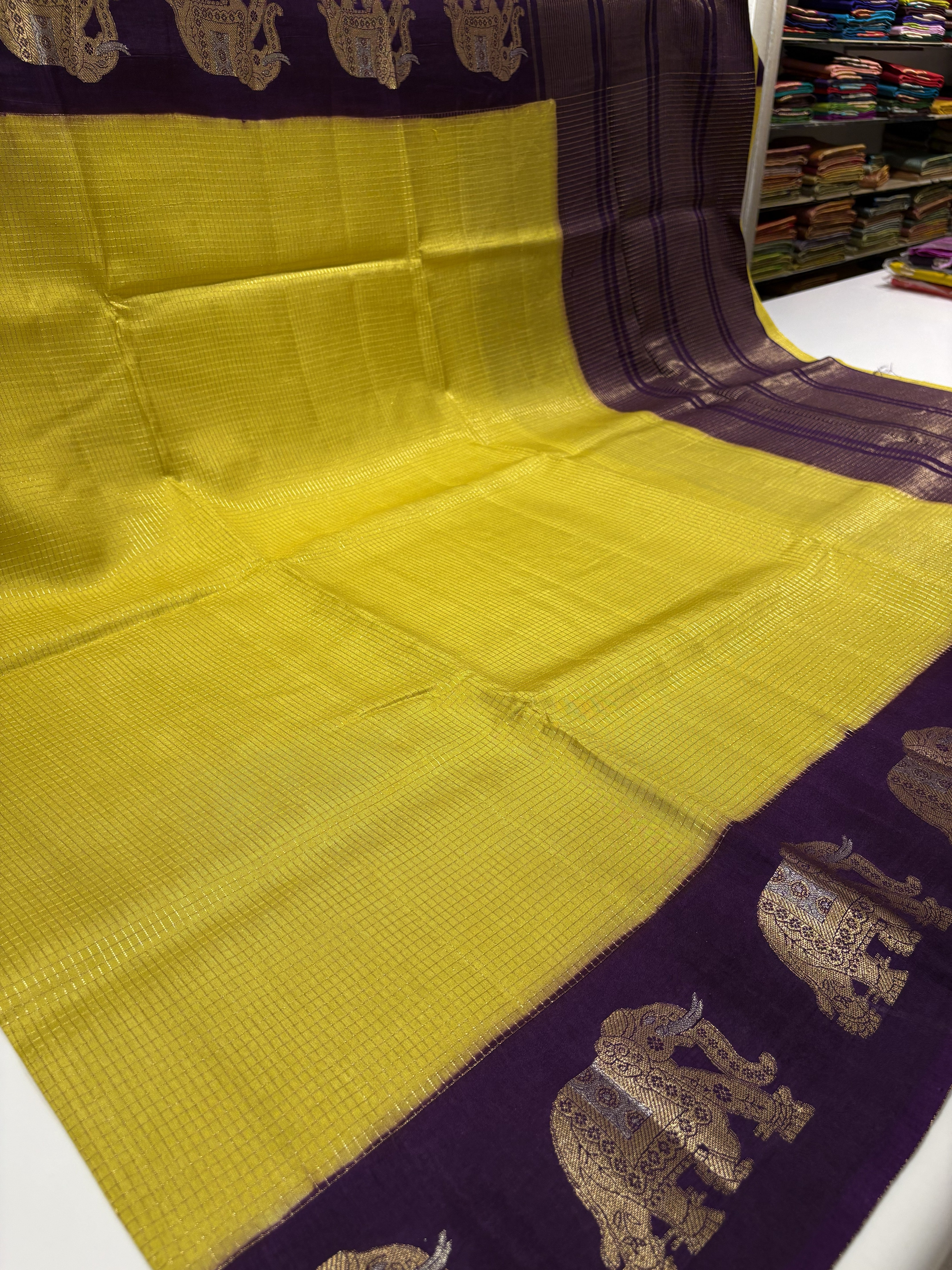 Beautiful Yellow Fancy Saree With Purple Contrast And Elephant Motifs on its Border
