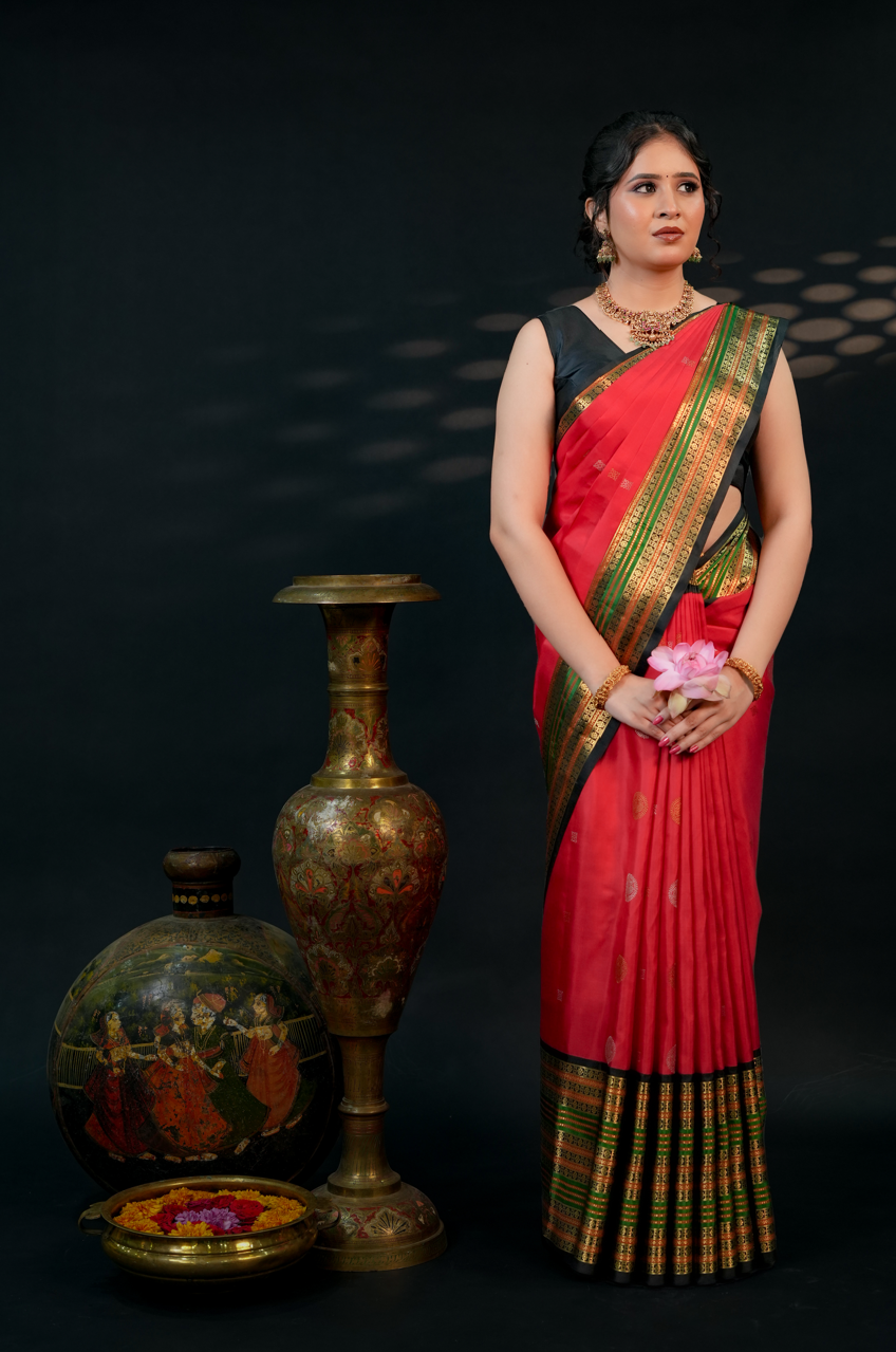 Red Pure Kanjivaram Silk Saree with Black Border & Gold Zari Buttas – Traditional Wedding & Bridal Collection