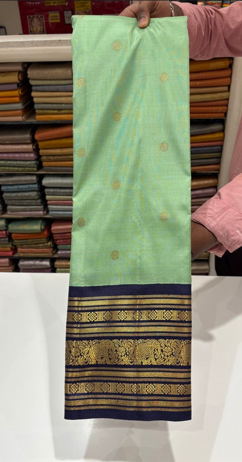 Green Kanjivaram Silk Saree with Contrast Blue Border & Zari Buttas