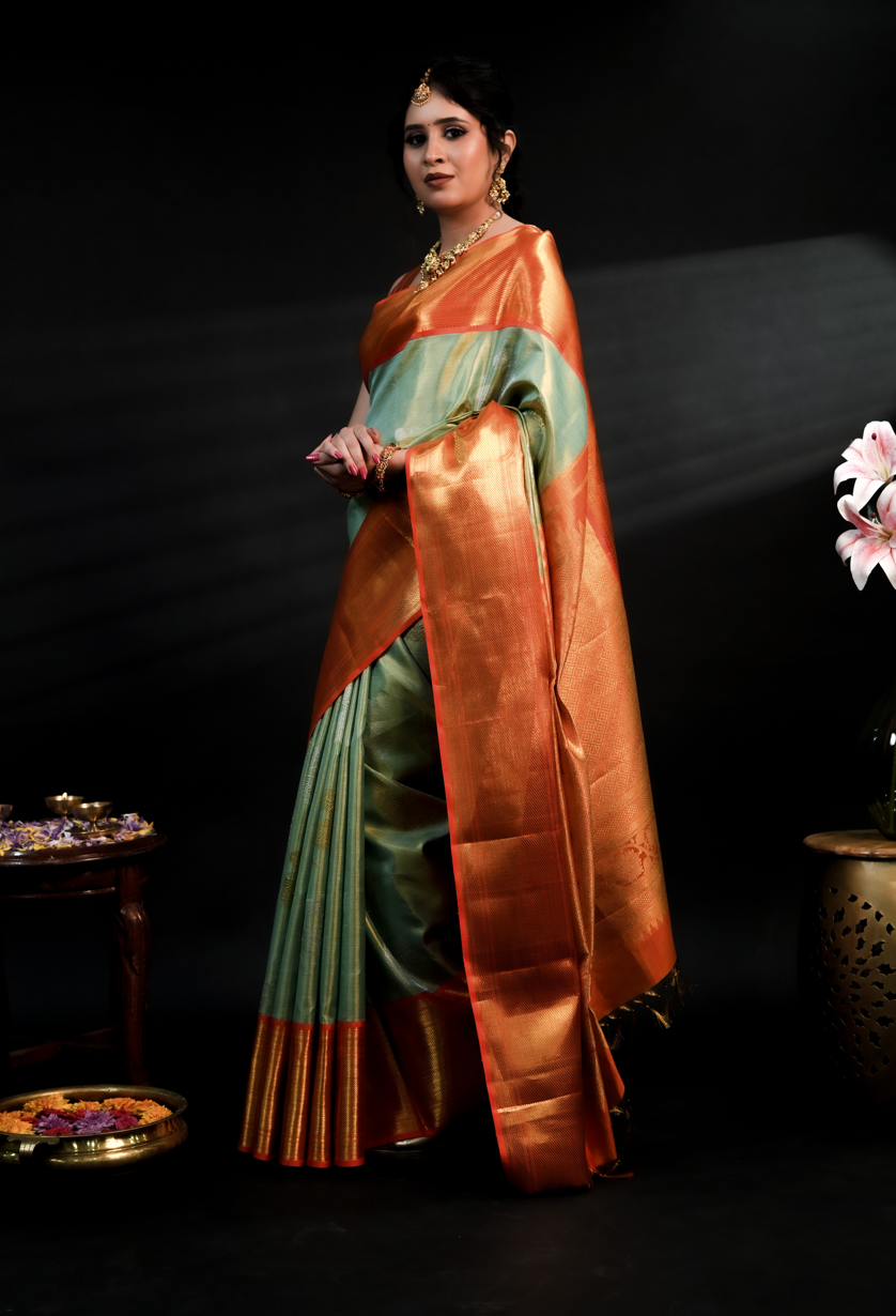 Pista Green Kanjivaram Silk Saree with Rich Orange Border and Dual Tone Yali Zari Design
