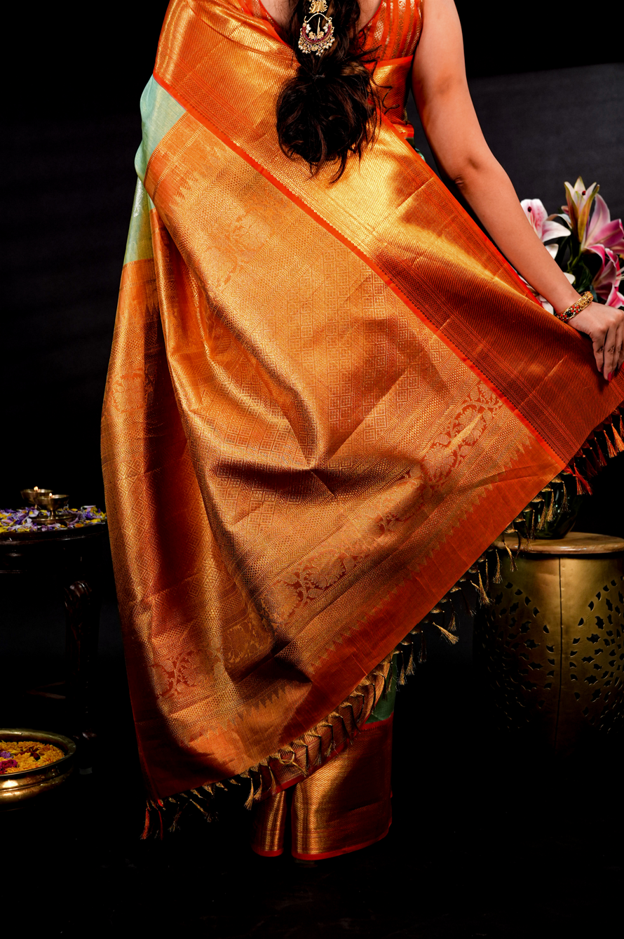 Pista Green Pure Kanjivaram Silk Saree with Rich Orange Border and Dual Tone Yali Zari Design