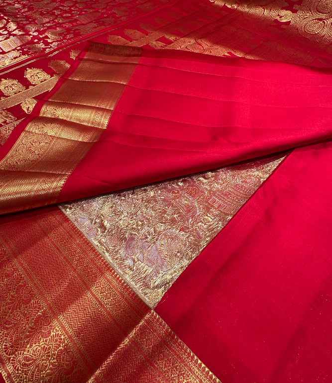 Red color Kanjivaram saree with full gold zari butta and border, perfect for bridal and wedding events.