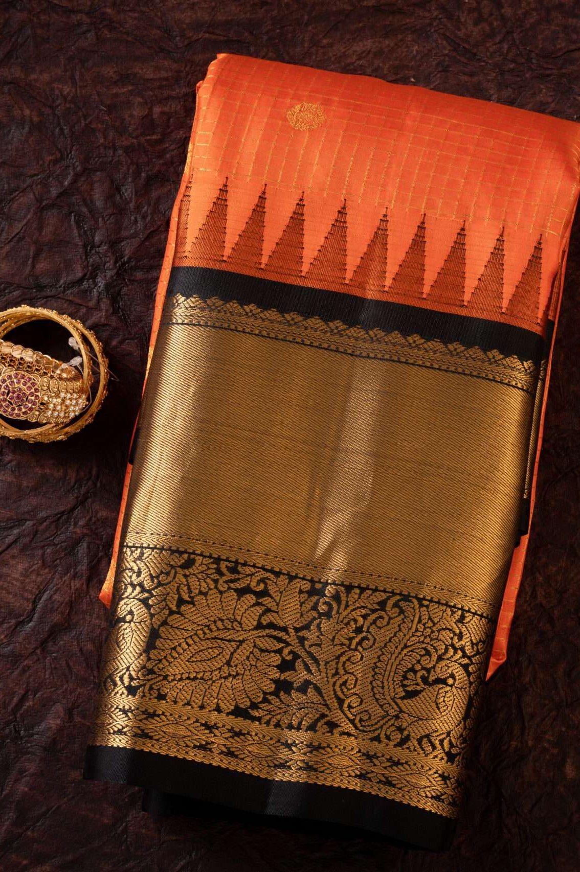 Orange Gadhwal Silk Saree with Black Border: Elegance and Grace - New Sudarshan Silks`