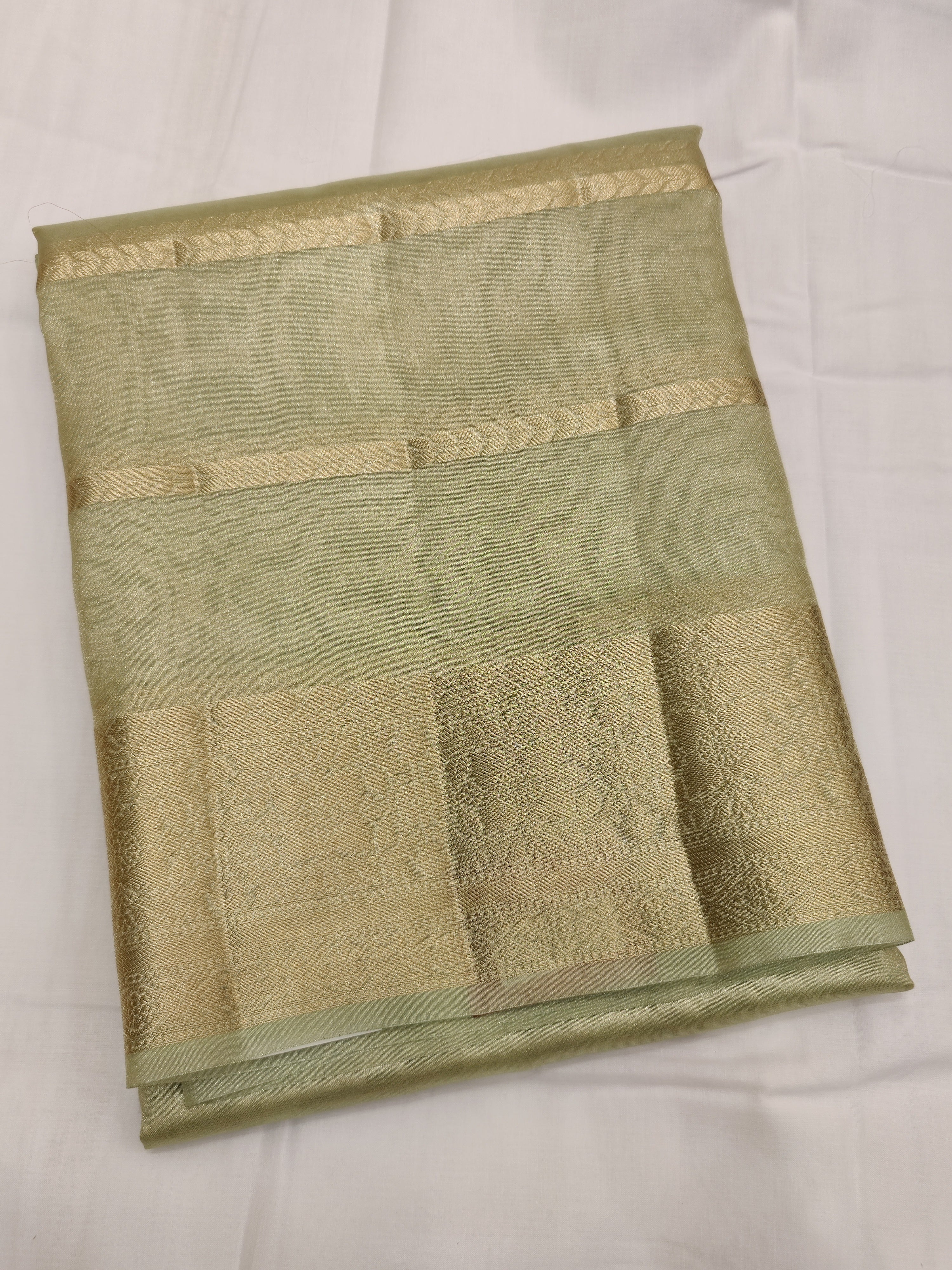 Chic Pista Green Saree with Elegant Line Design and Gold Border