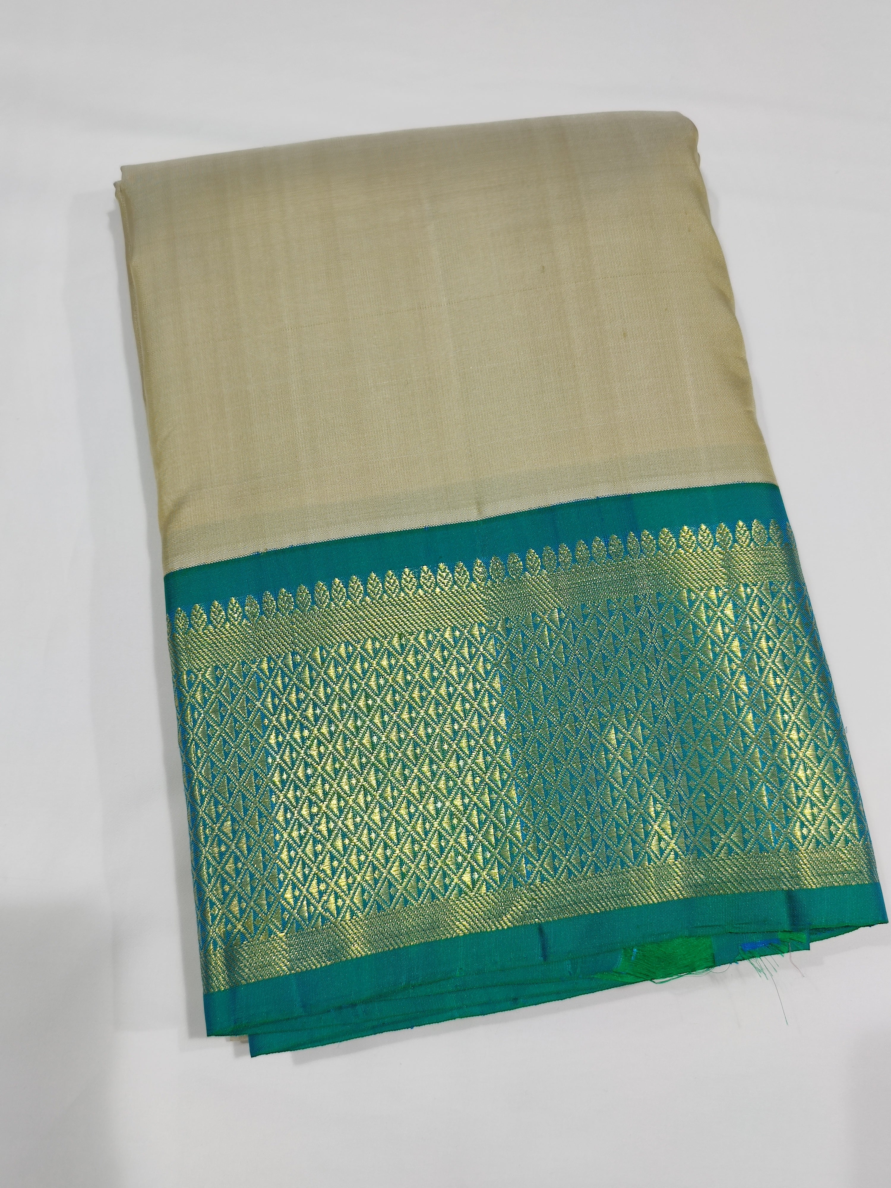 "Pure Cream Kanjivaram Silk Dhoti with Rama Green & Gold Zari Border + Shirt Piece – Wedding Collection"