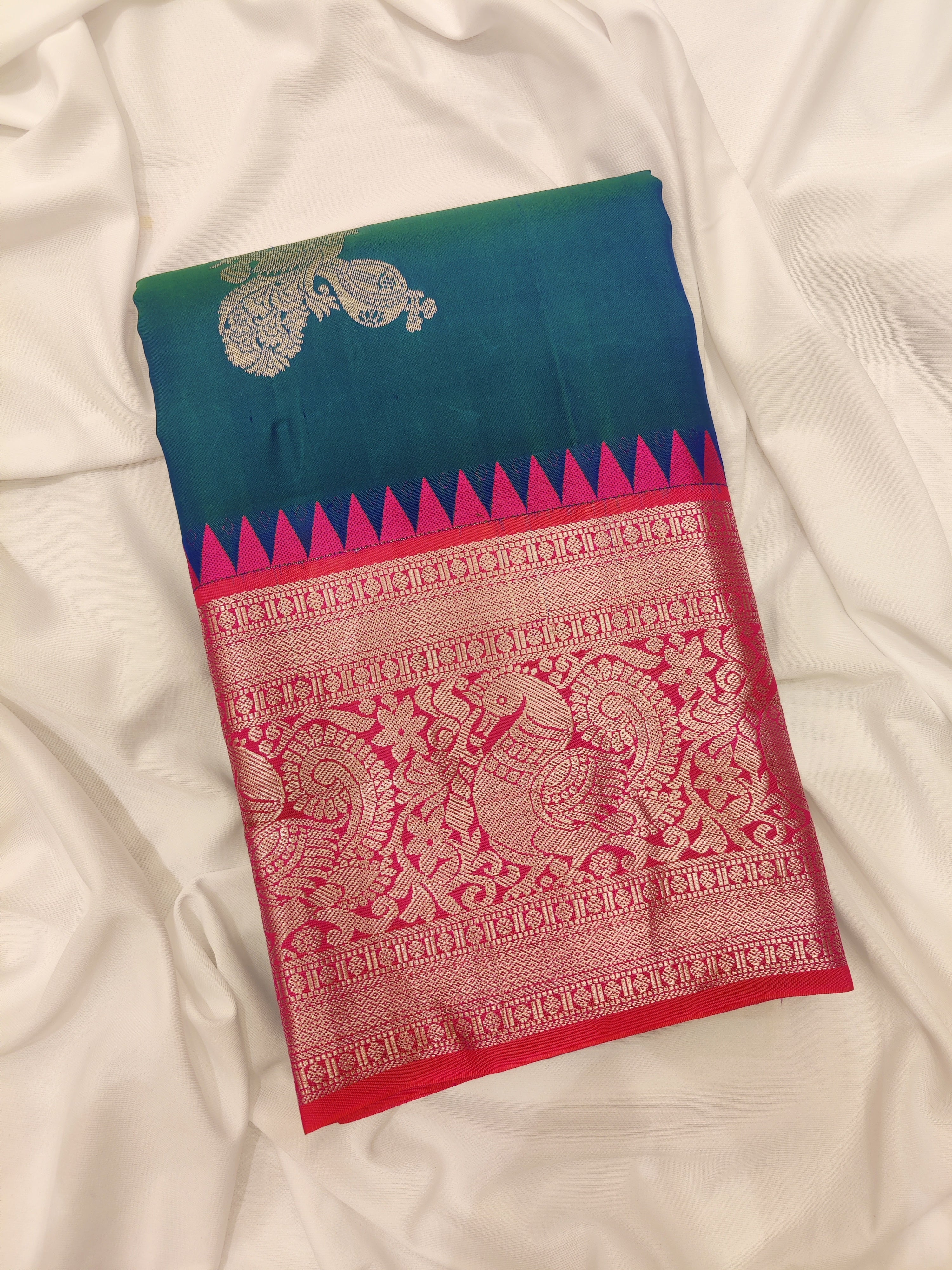 Peacock Blue Kanjivaram Silk Saree with Radium Pink Temple Border – Pure Handloom Bridal Saree Online