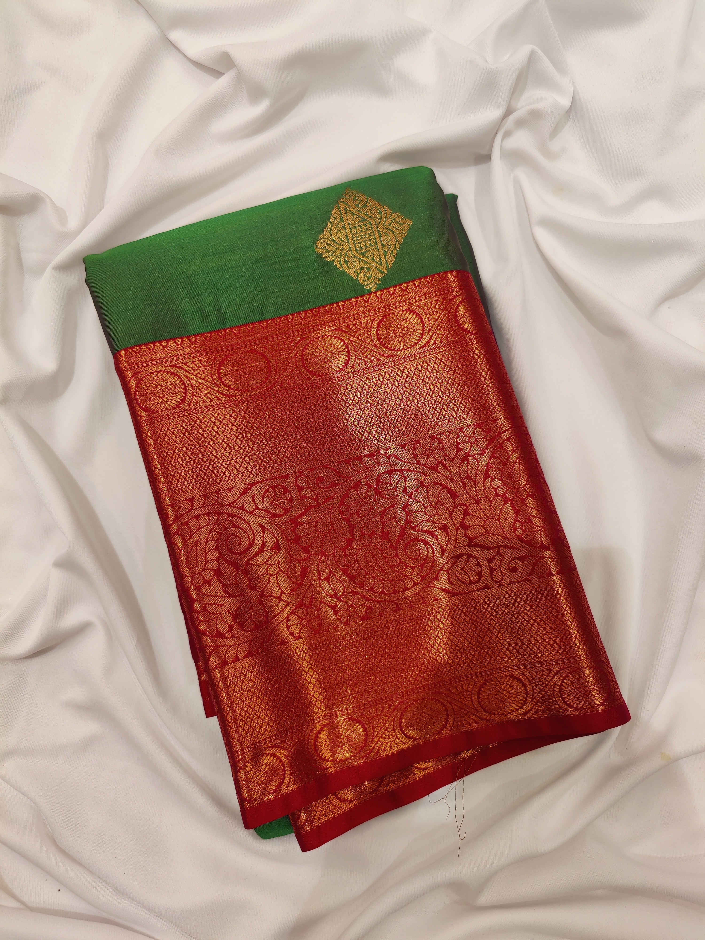 Parrot Green Saree with Red Traditional Border – A Classic Blend of Heritage and Grace - New Sudarshan Silks`