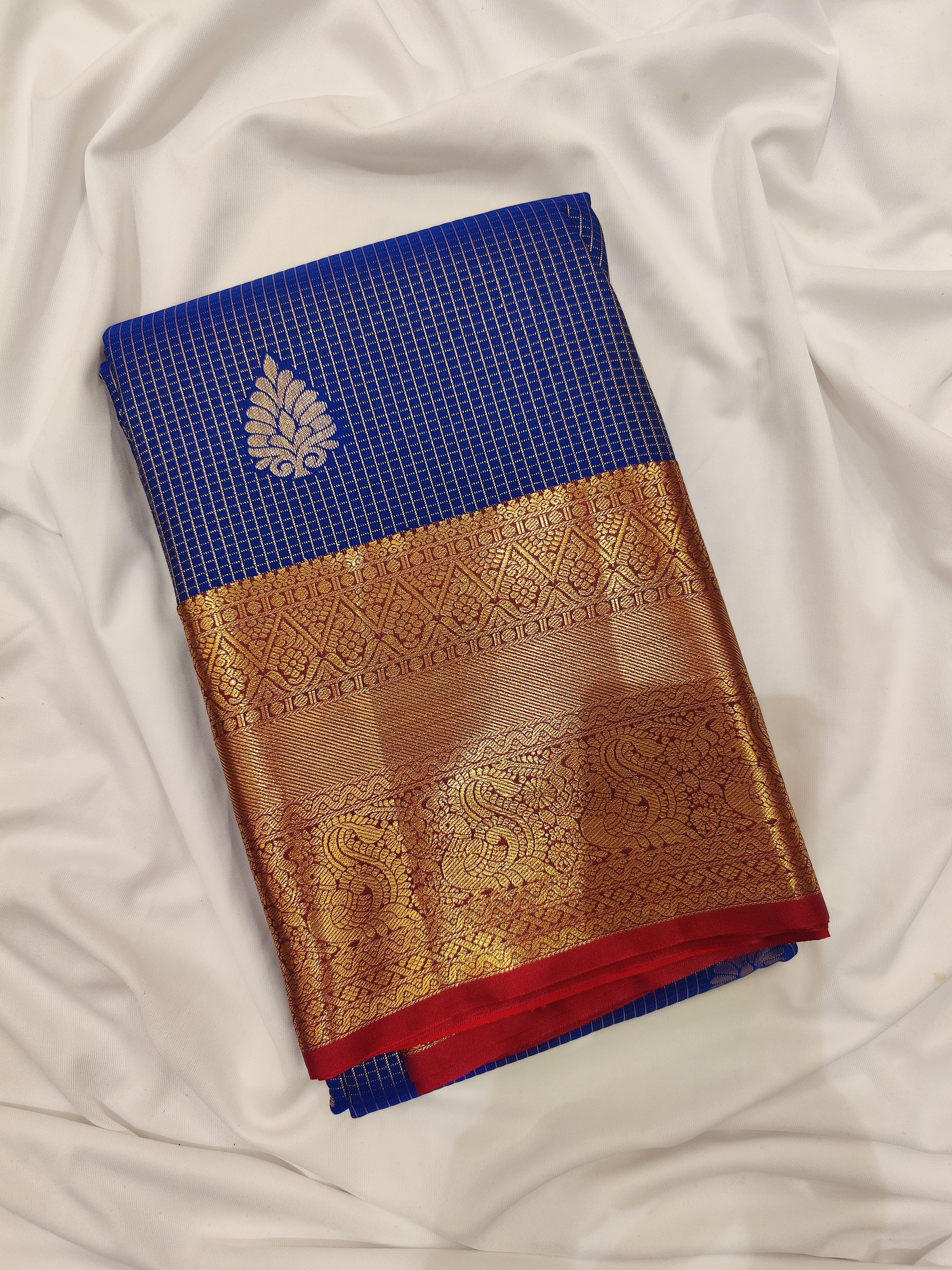 Navy Blue Checks Design Saree with Red Border – A Perfect Blend of Tradition and Style - New Sudarshan Silks`