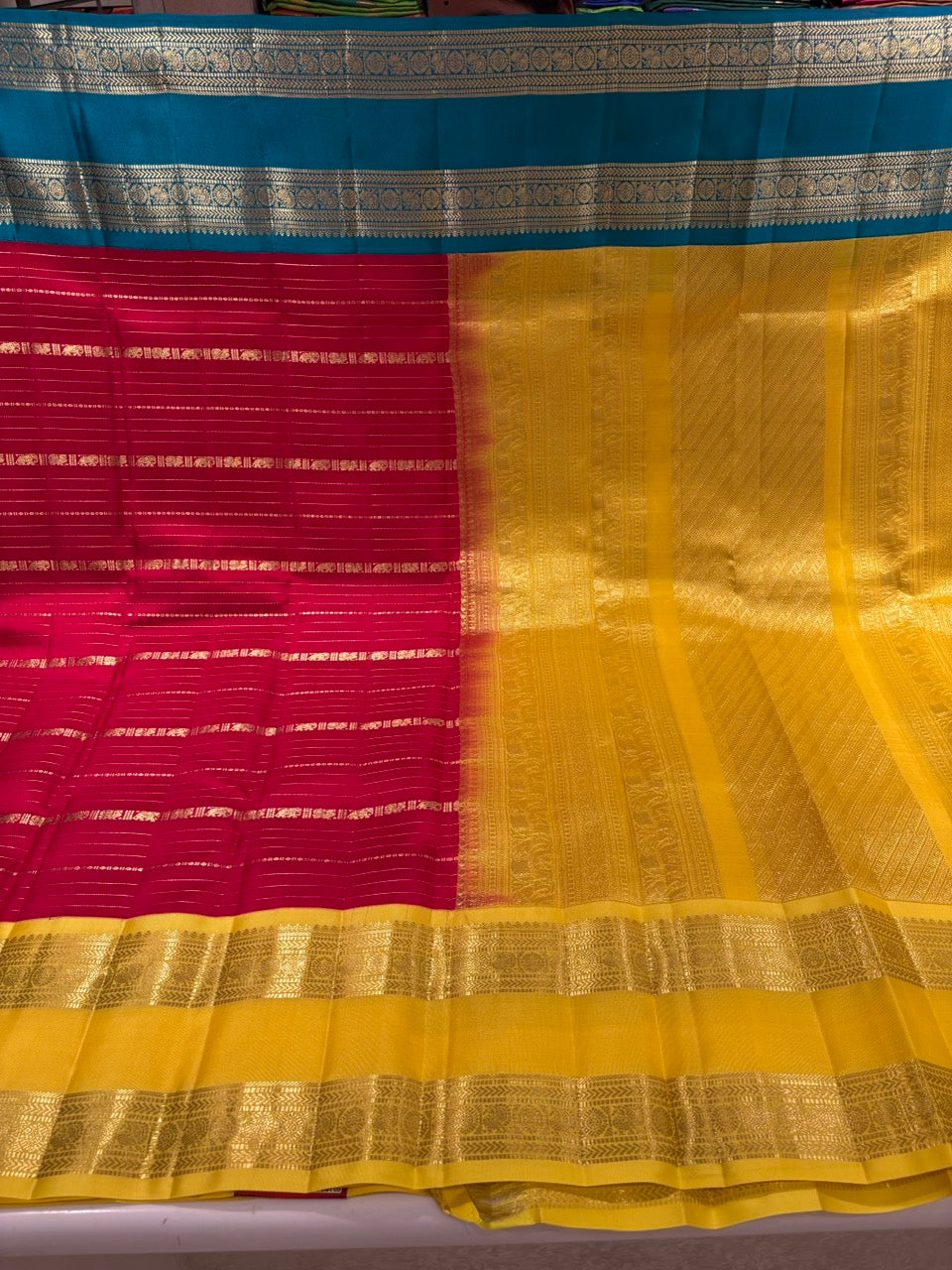 Red Colour Ganga Jamuna Saree with Yellow & Sky Blue Border
