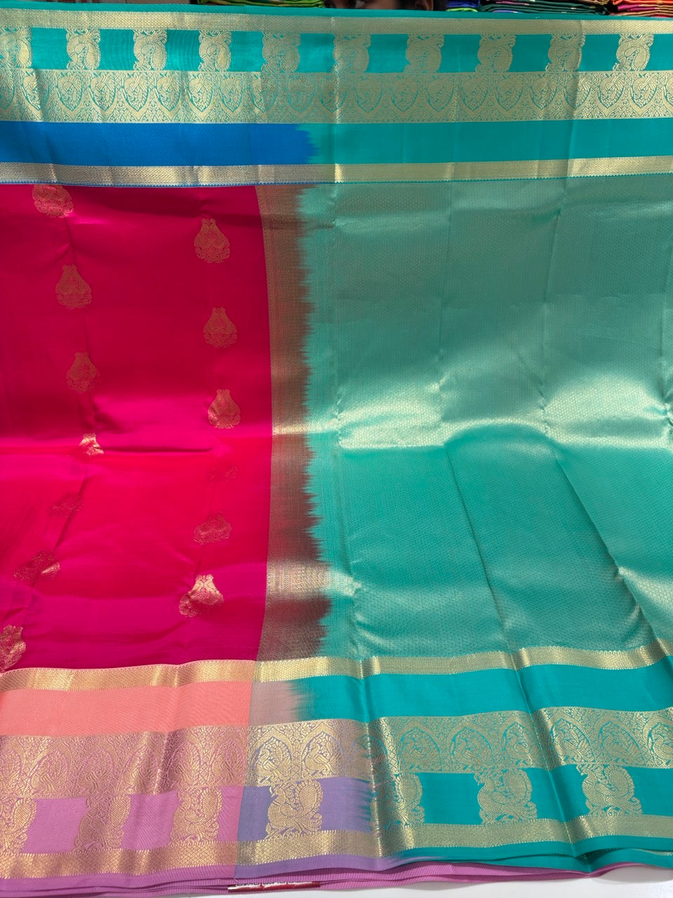 Magenta Pink Colour Ganga Jamuna Saree with Peach, Lavender & Sky Blue Border