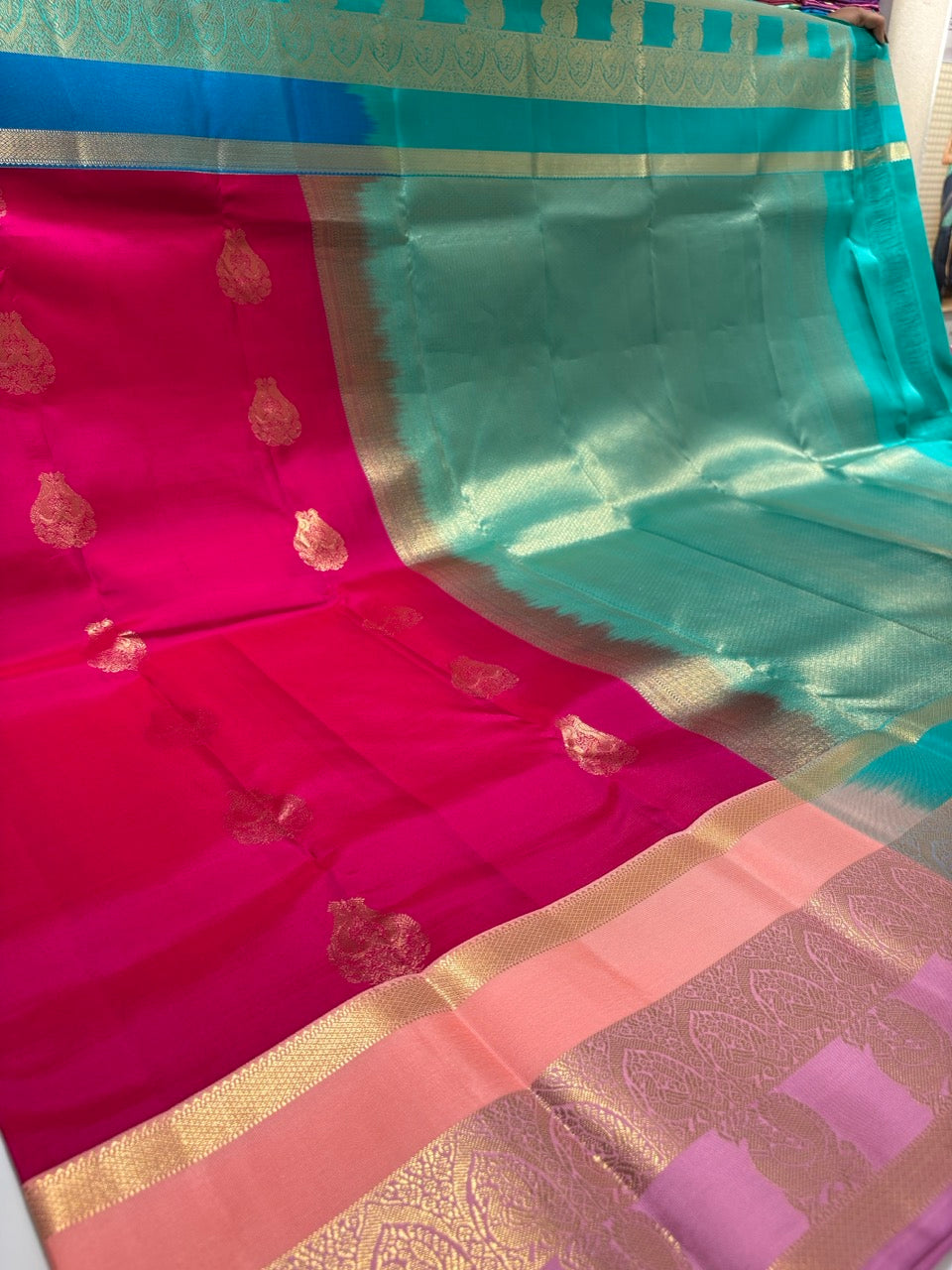 Magenta Pink Colour Ganga Jamuna Saree with Peach, Lavender & Sky Blue Border