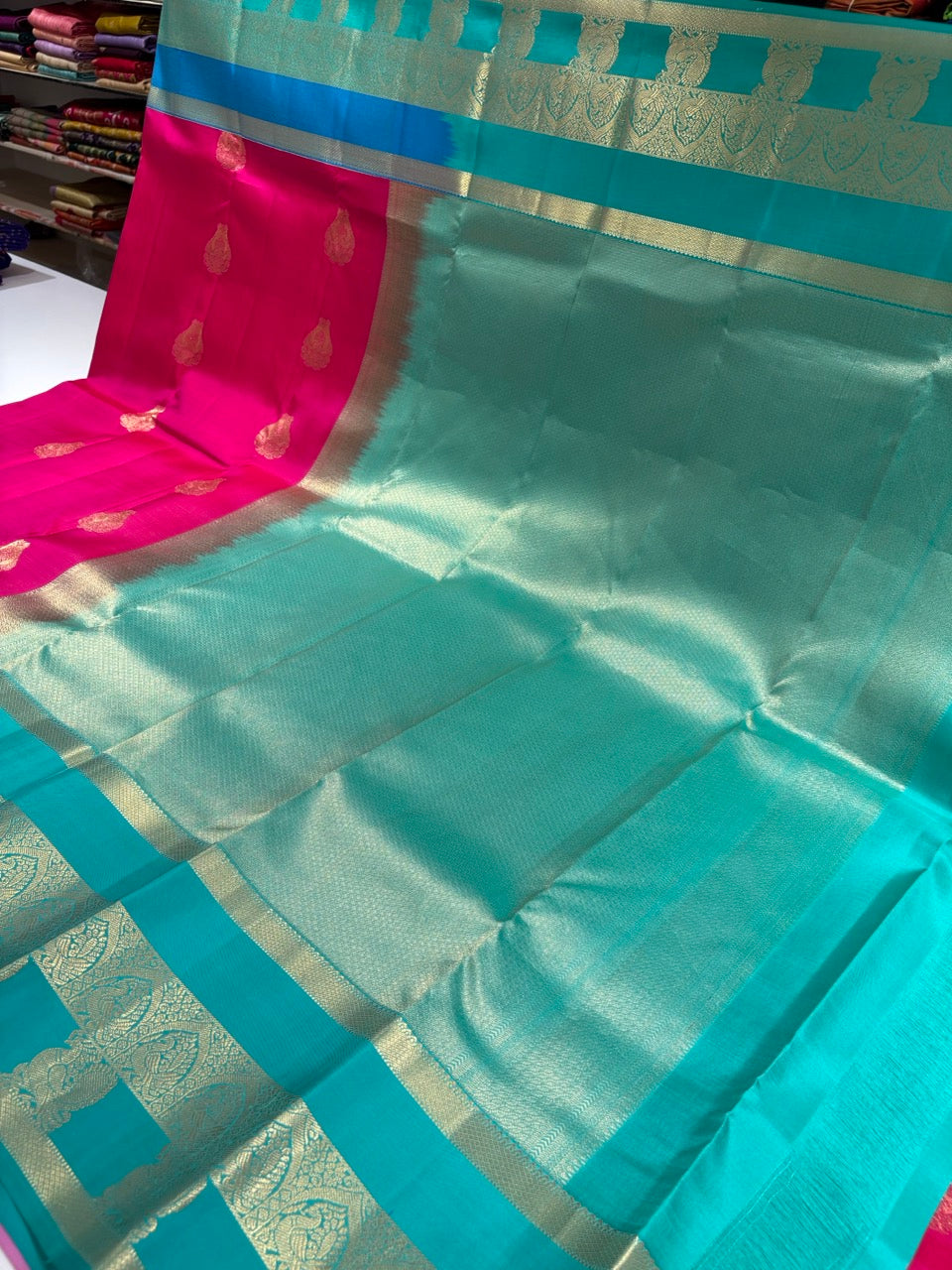 Magenta Pink Colour Ganga Jamuna Saree with Peach, Lavender & Sky Blue Border