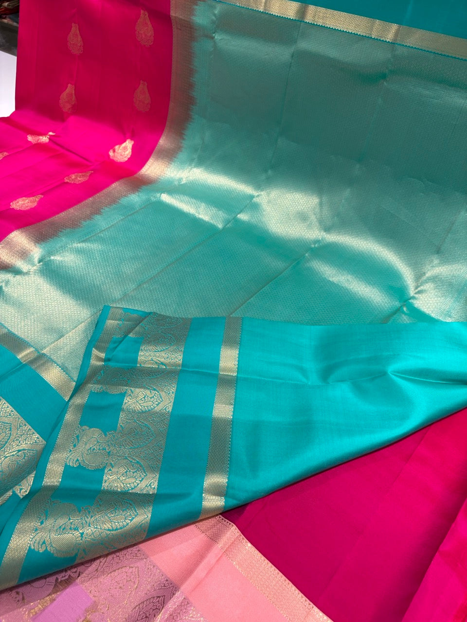 Magenta Pink Colour Ganga Jamuna Saree with Peach, Lavender & Sky Blue Border