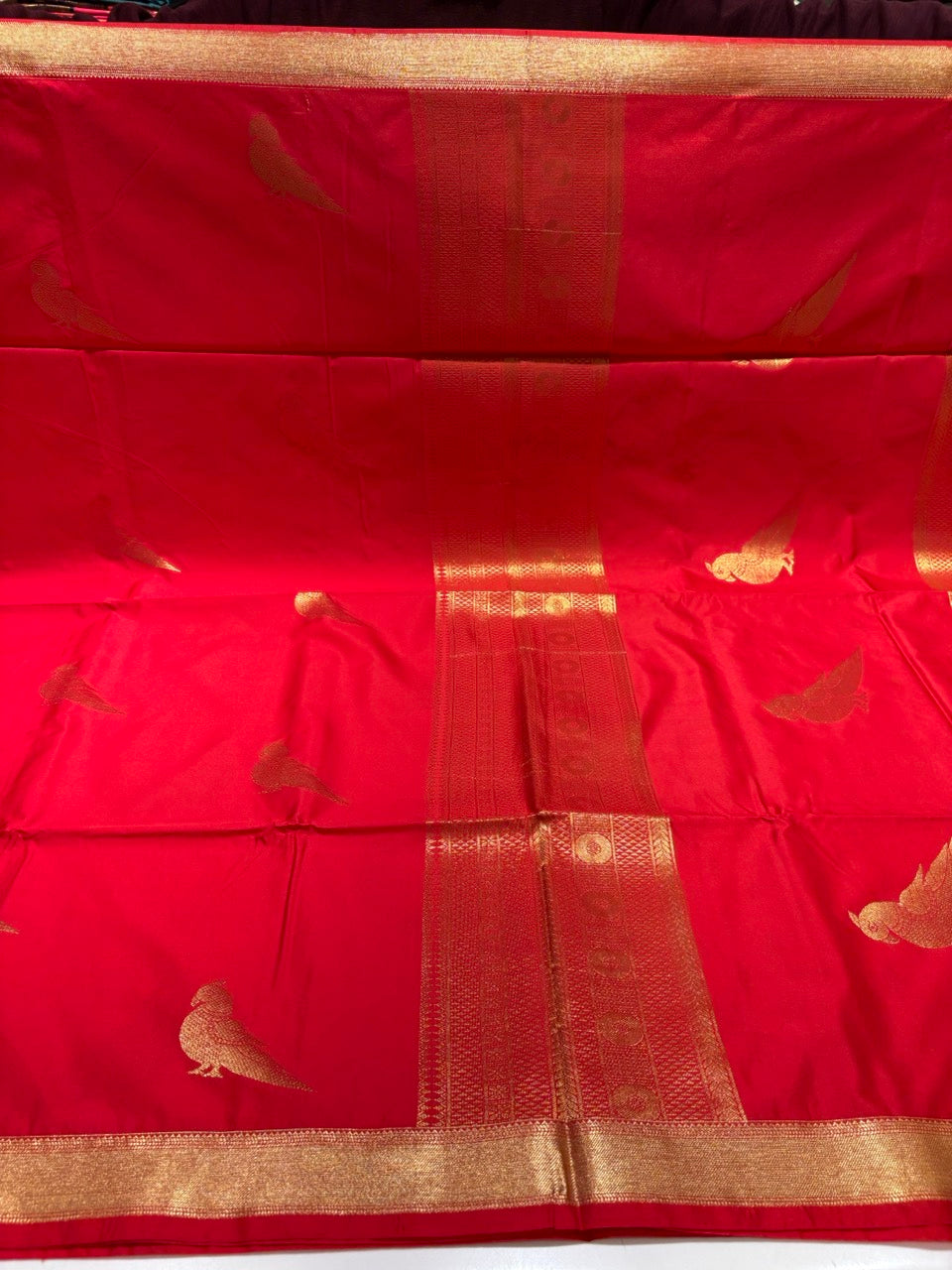 Red Colour Semi Silk Saree with Gold Zari Border & Parrot Butta