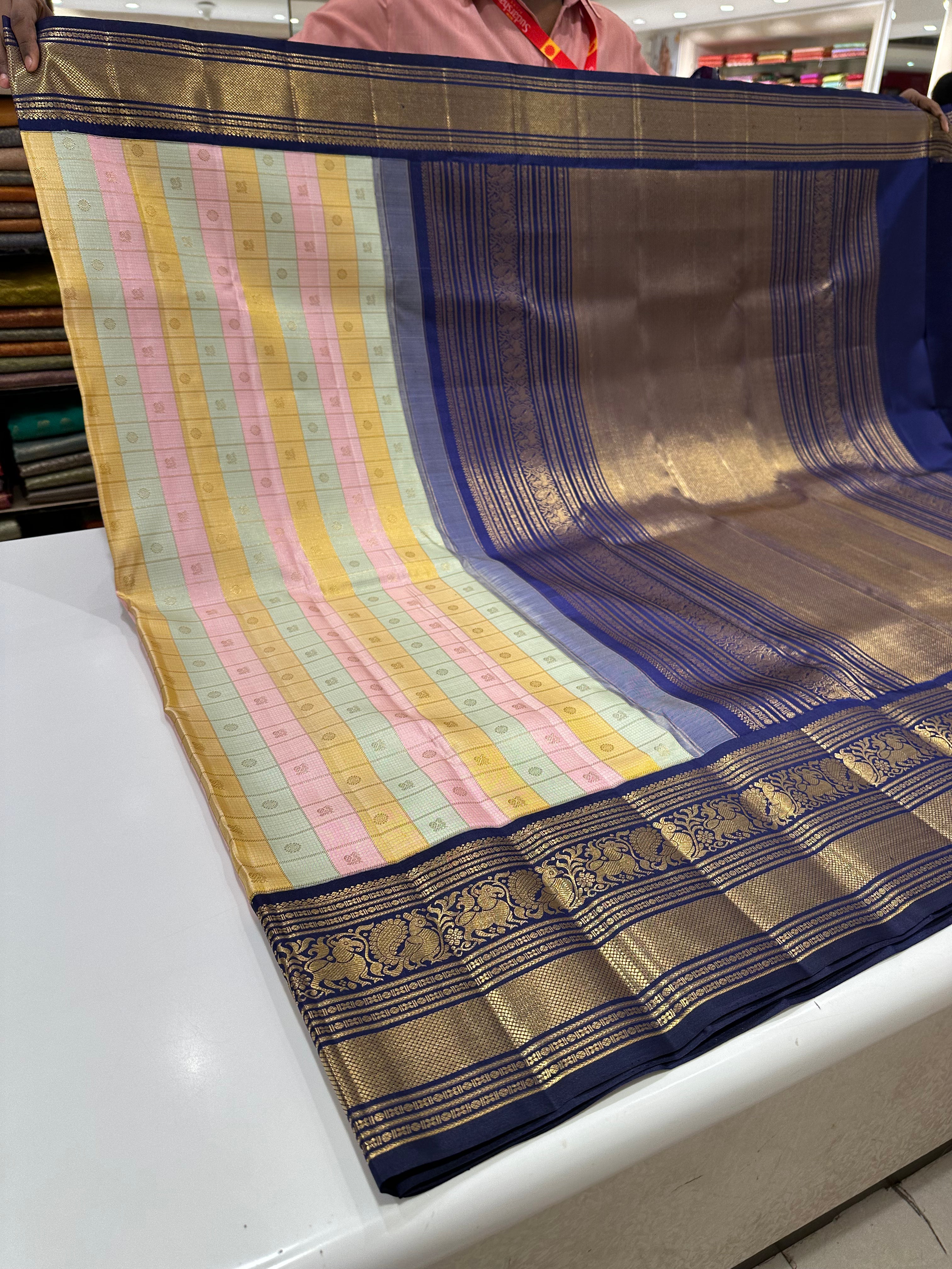 Pure Kanjivaram Silk Multicolor Checks Saree with Peacock Rudrakshi Buttas and Blue Gold Zari Border.