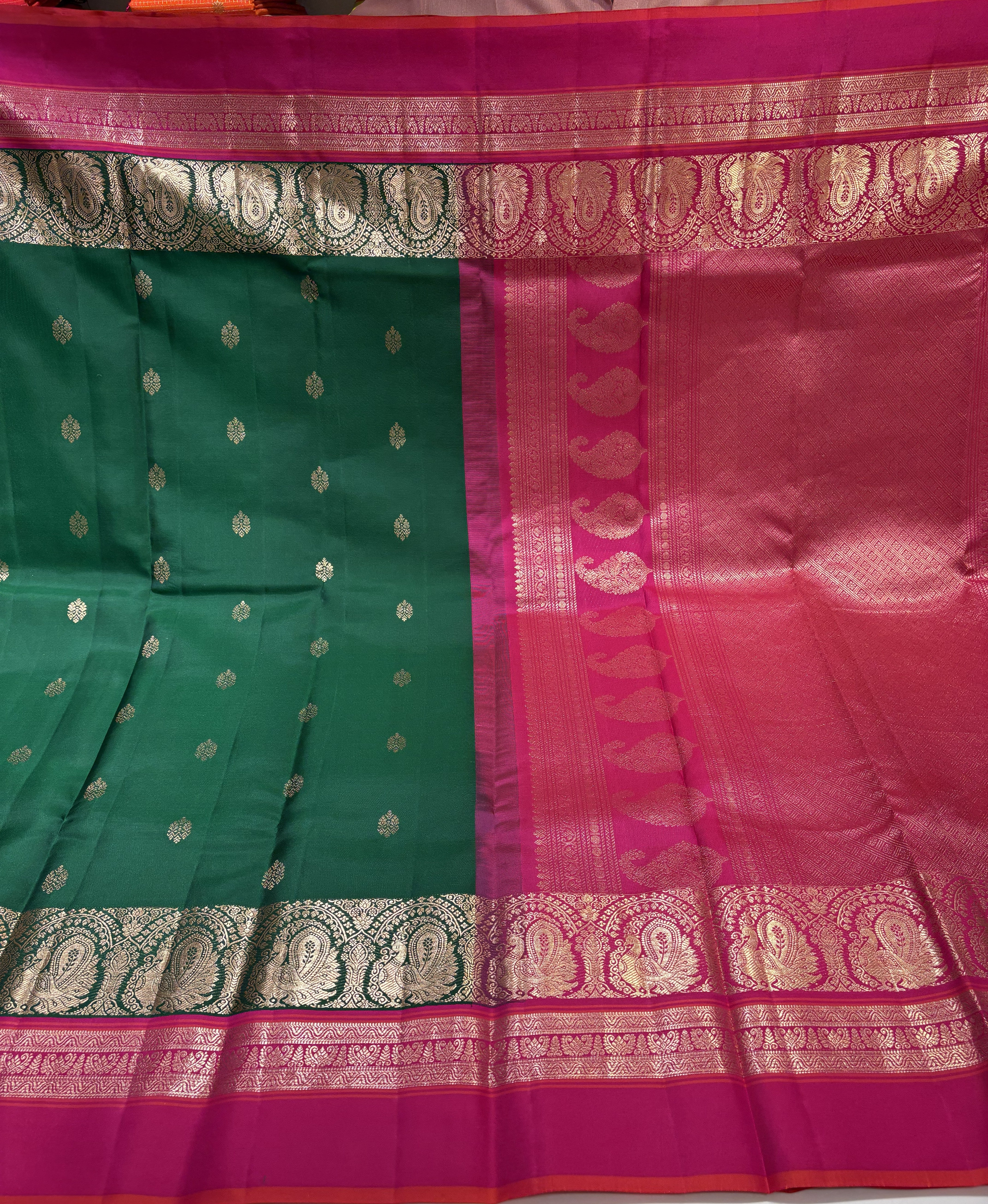 Exquisite Bottle Green Pure Kanjivaram Silk Saree with Magenta Pink Contrast