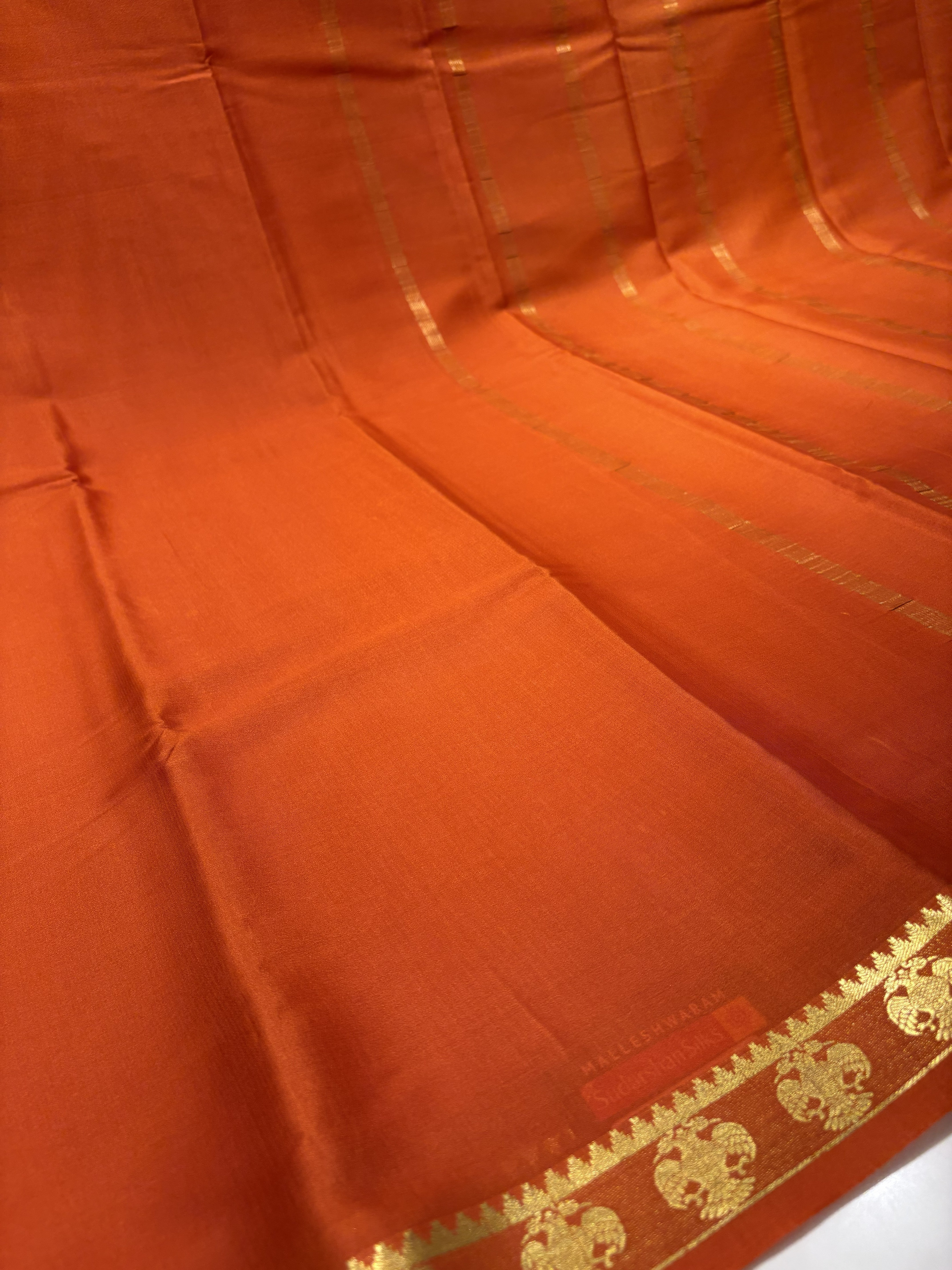 Rust Orange Mysore Silk Crepe Saree(60 gsm) With Gandaberunda motifs Border In gold Zari