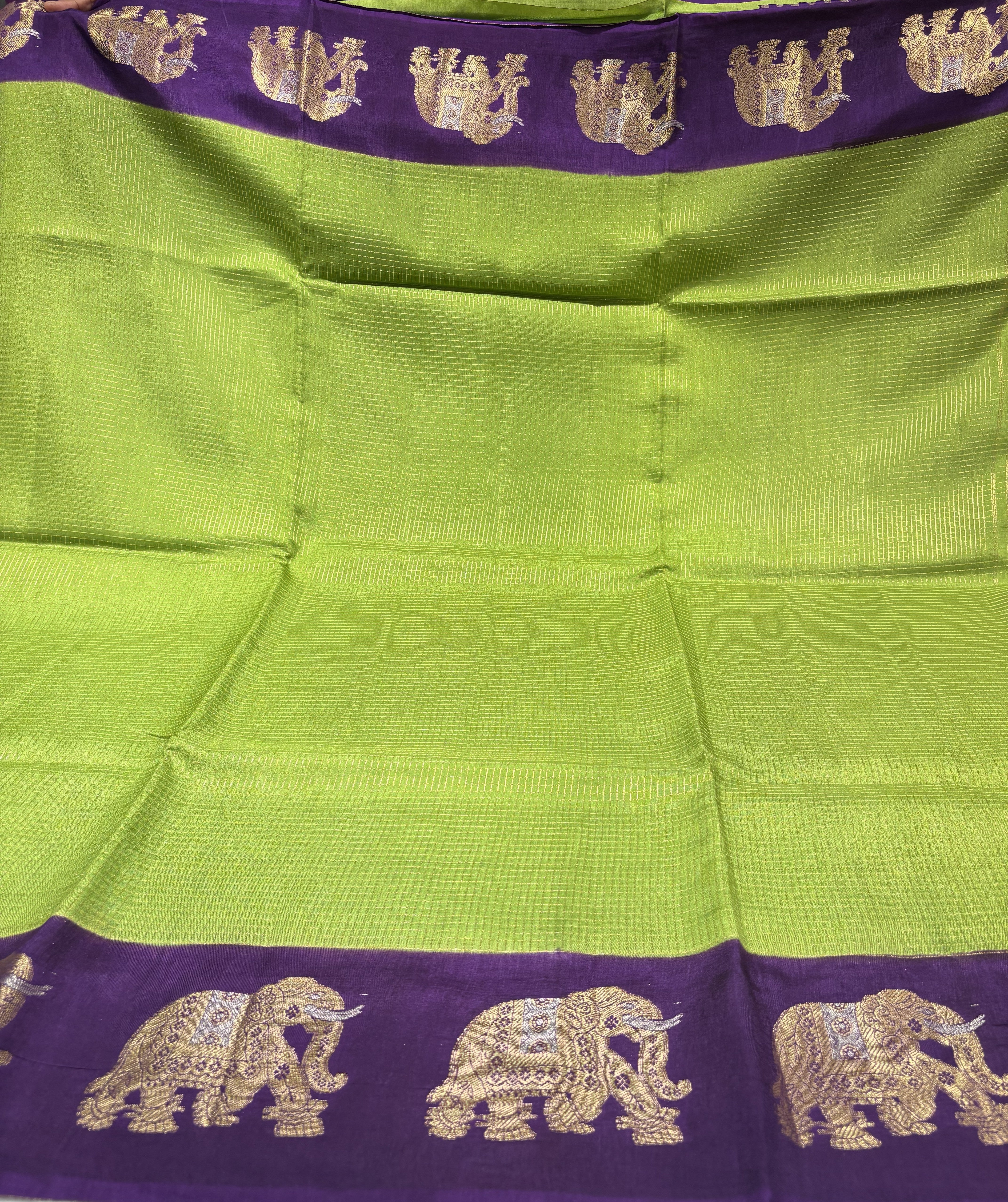 Beautiful Parrot Green Fancy Saree With Purple Contrast And Elephant Motifs on its Border