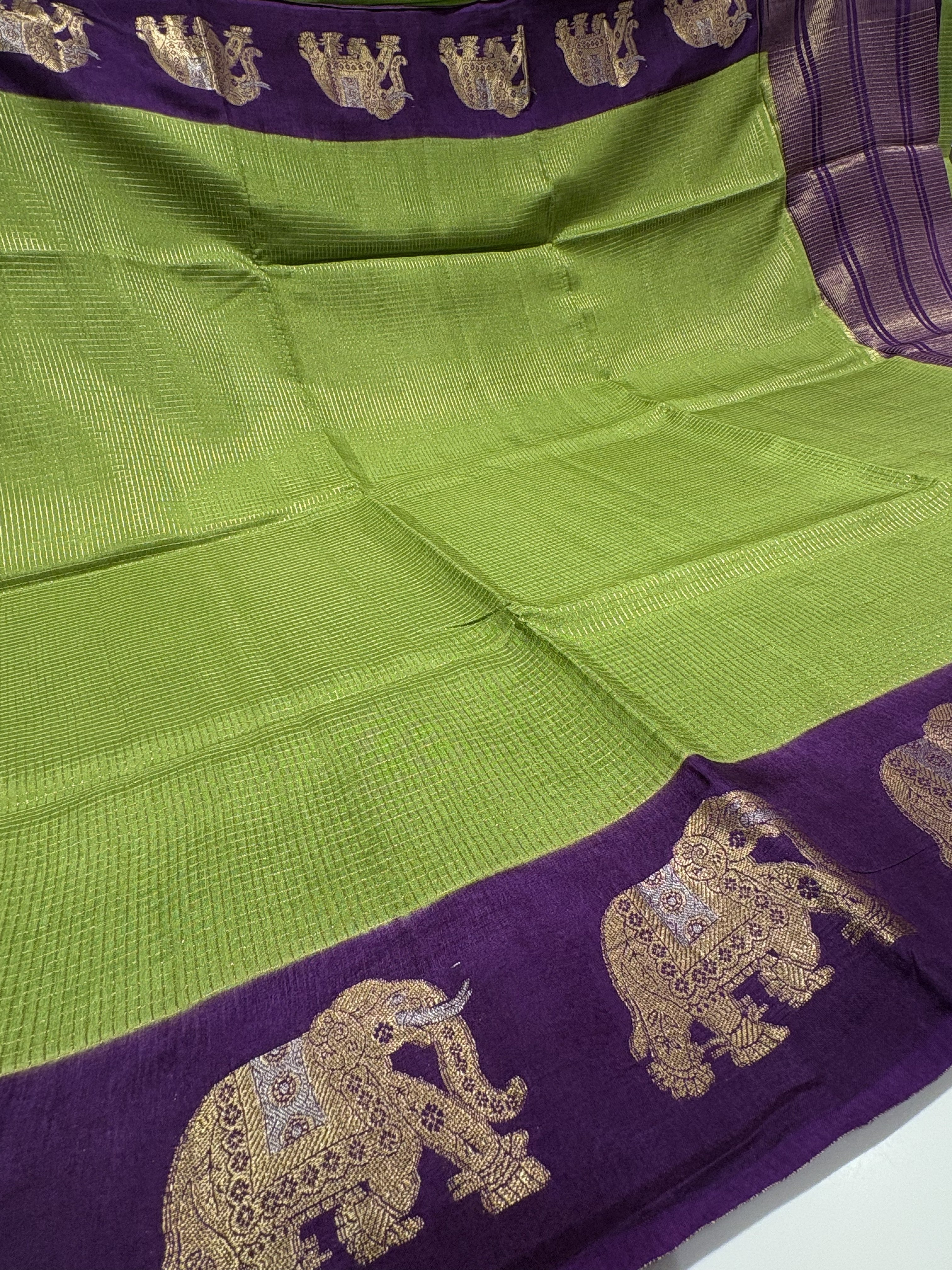 Beautiful Parrot Green Fancy Saree With Purple Contrast And Elephant Motifs on its Border
