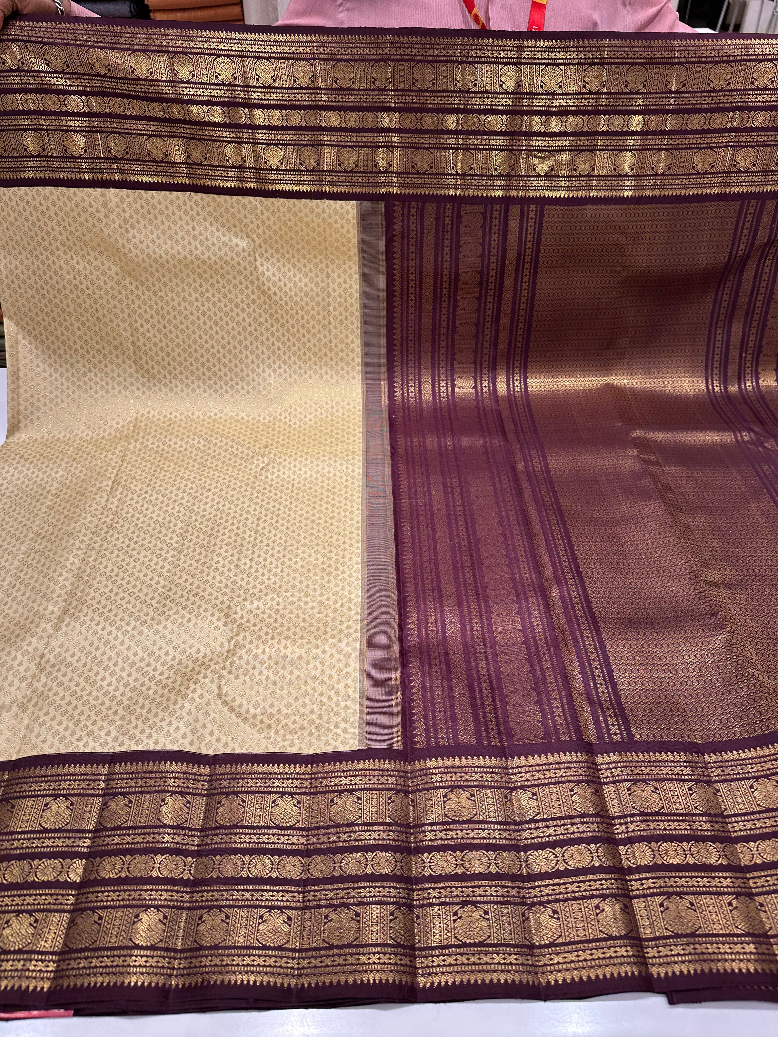 Classic Royal White Saree with Brown Border & Grand Zari Weaving – Leela Verse