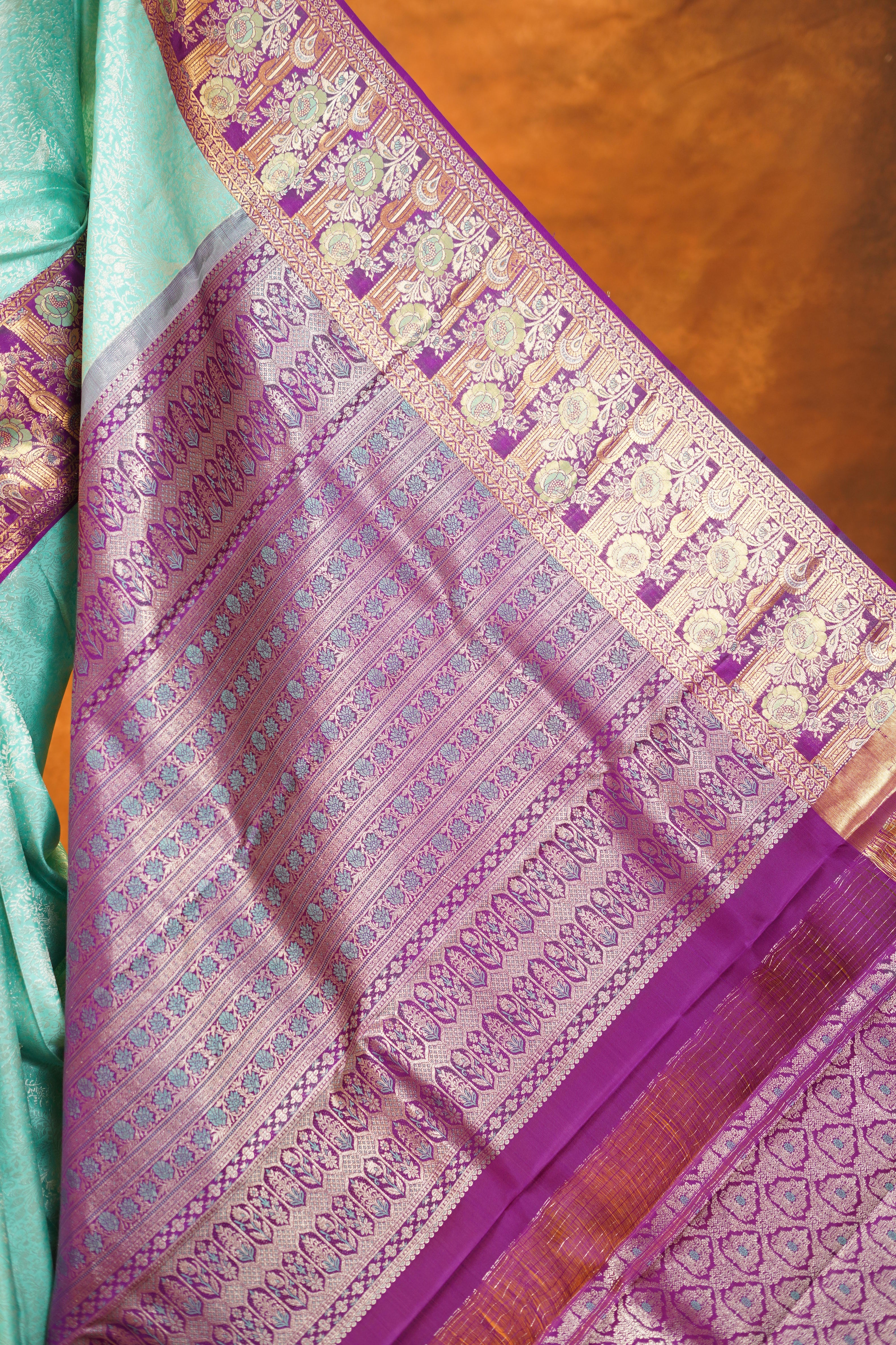 Pastel Green colour Pure Kanjivaram Silk Saree with Purple contrast