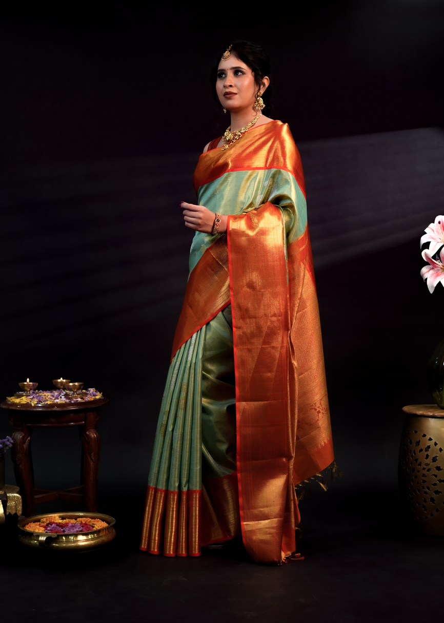 Pista Green Pure Kanjivaram Silk Saree with Rich Orange Border and Dual Tone Yali Zari Design