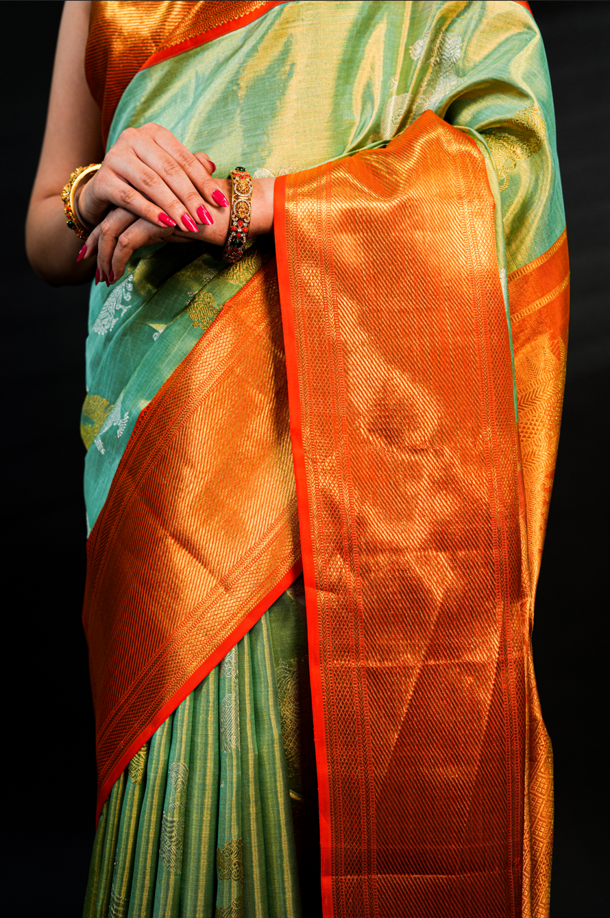 Pista Green Pure Kanjivaram Silk Saree with Rich Orange Border and Dual Tone Yali Zari Design