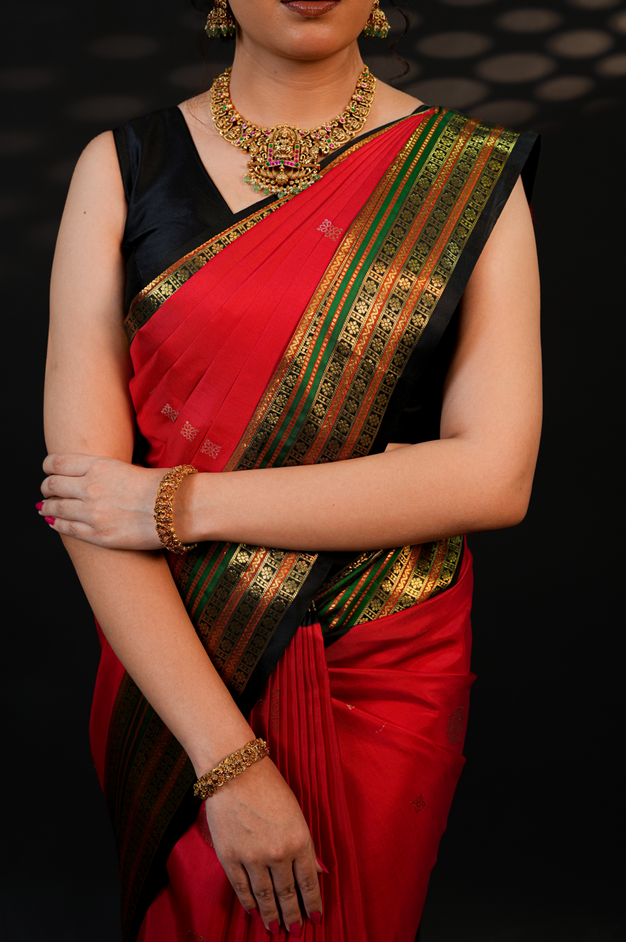 Red Pure Kanjivaram Silk Saree with Black Border & Gold Zari Buttas – Traditional Wedding & Bridal Collection