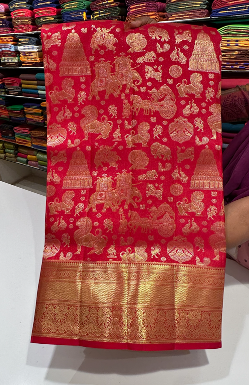 Red color Kanjivaram saree with full gold zari butta and border, perfect for bridal and wedding events.